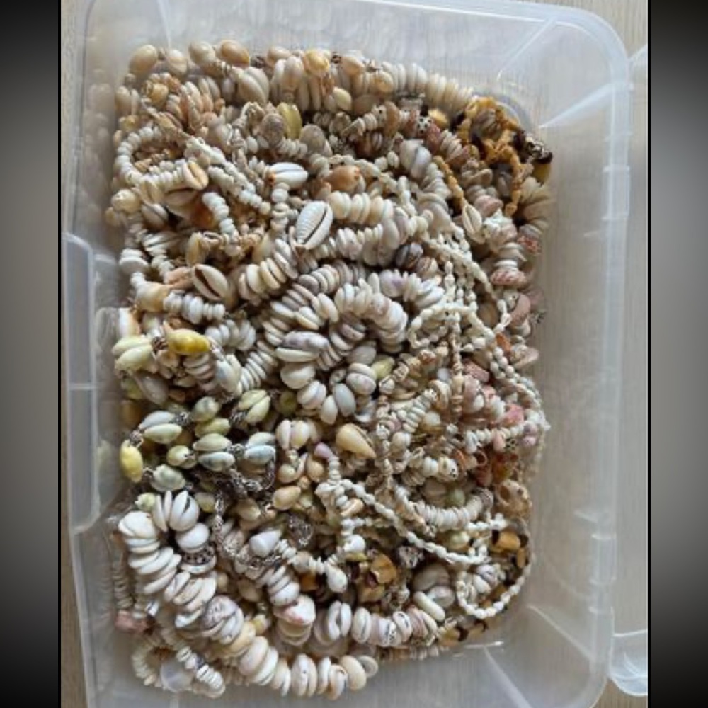 Box of puka shells from Hawaii. All made into necklaces but can be taken apart.